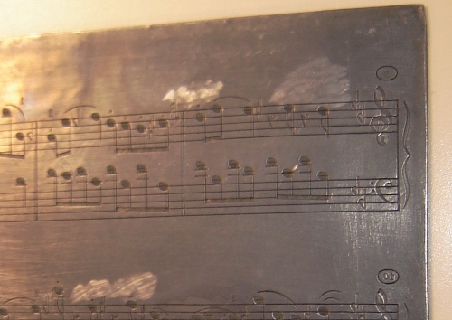 sheet music engraving on plate